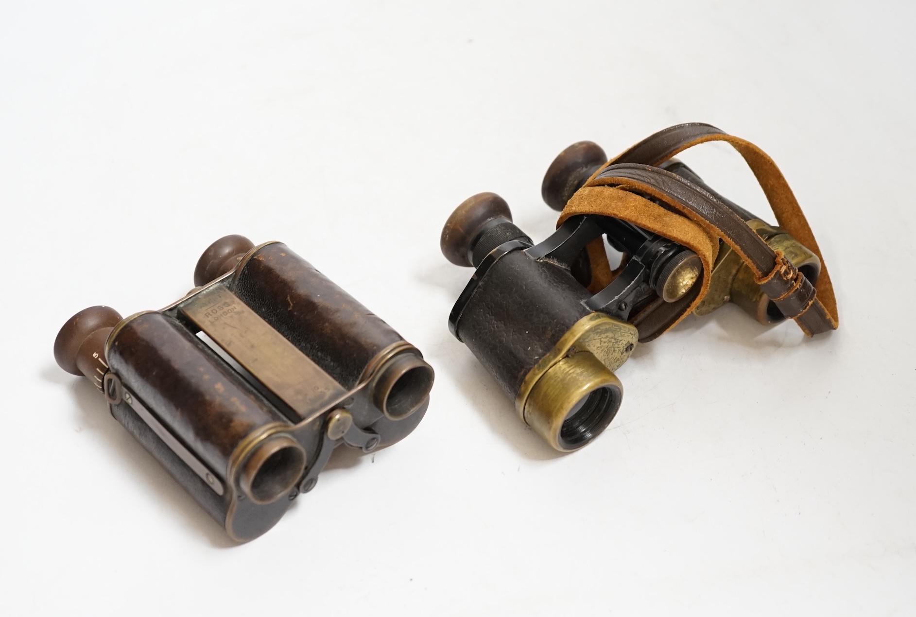 A pair of early Ross binoculars and one other pair of binoculars. Condition - fair